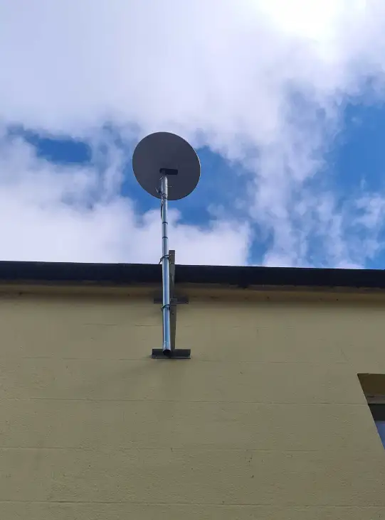 starlink antenna installed on the side of a domestic property in Meath